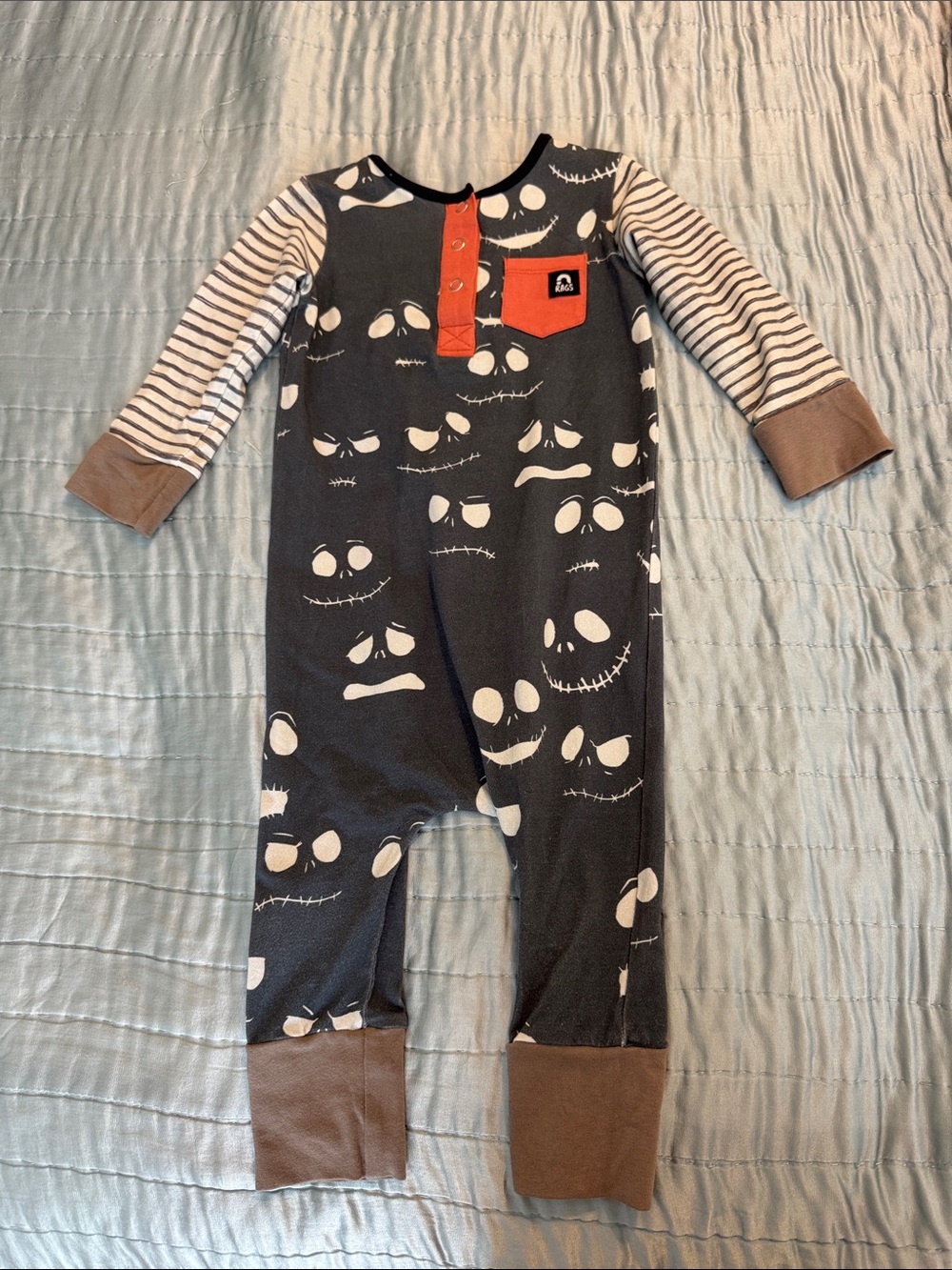 Rags to Raches Jack Skellington Black Onesie with Orange Pocket Accents